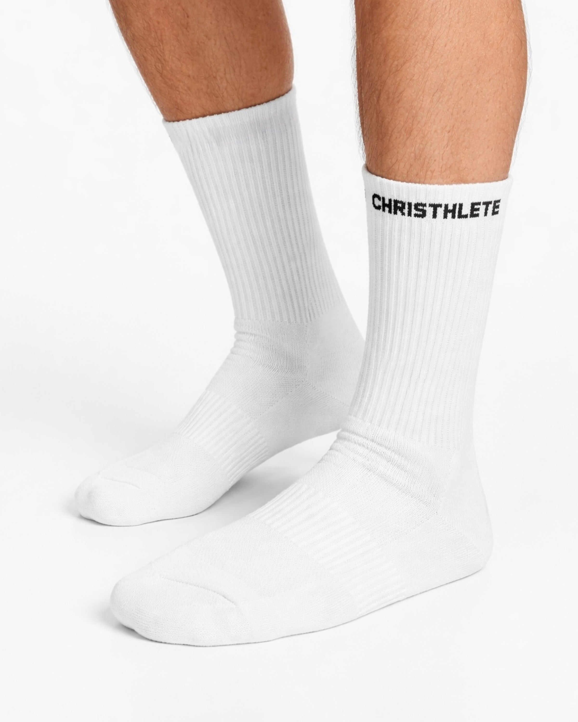 Image of White socks with 'CHRISTHLETE' branding on a white background