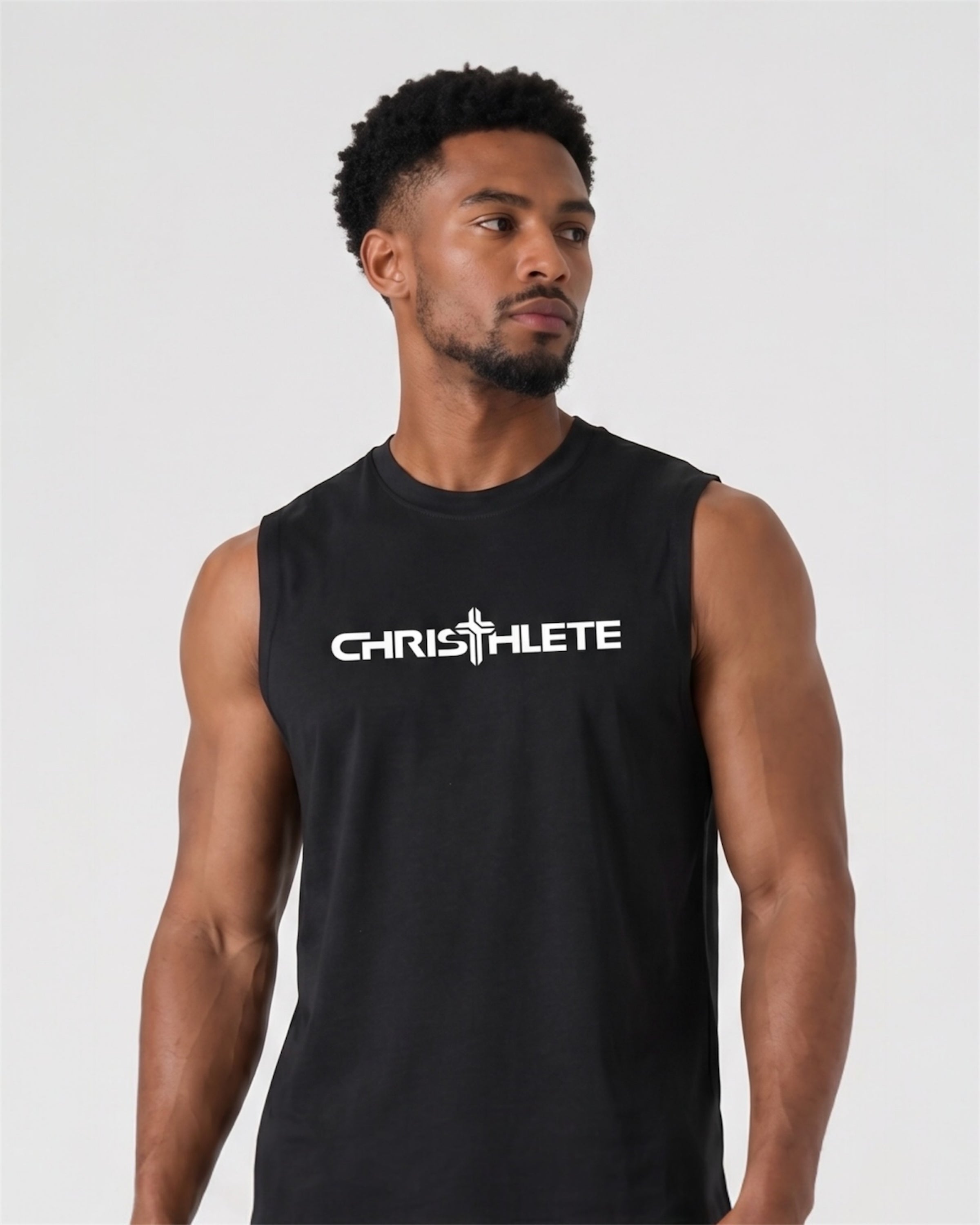 Man wearing a black sleeveless shirt with 'CHRISTHLETE' logo on a white background