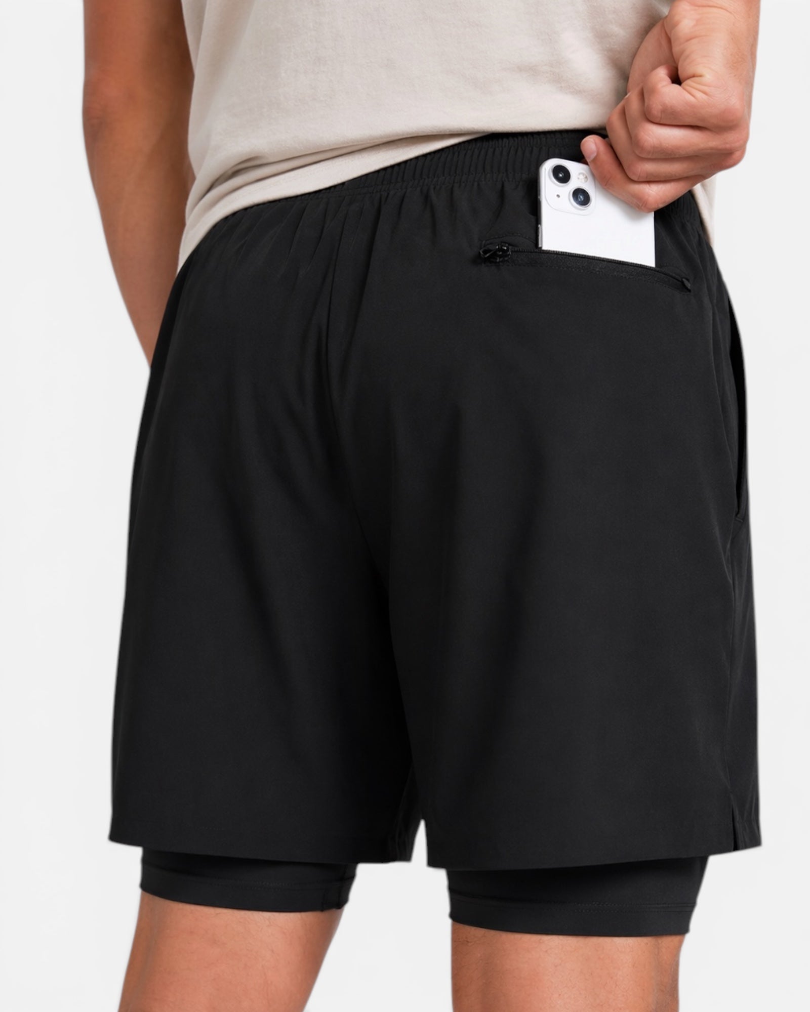 Image of Person wearing black shorts with a white background
