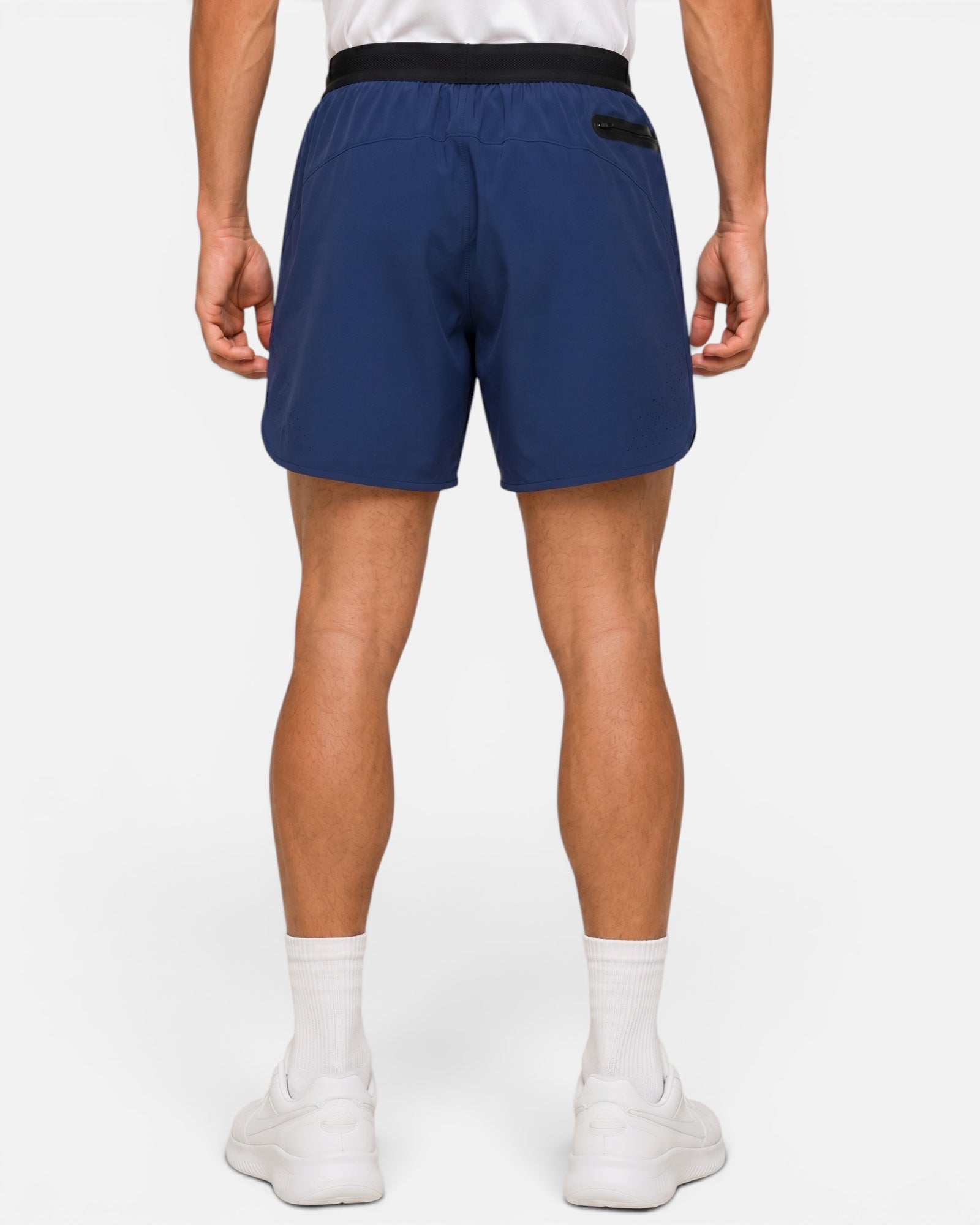 Image of Person wearing blue shorts on a white background