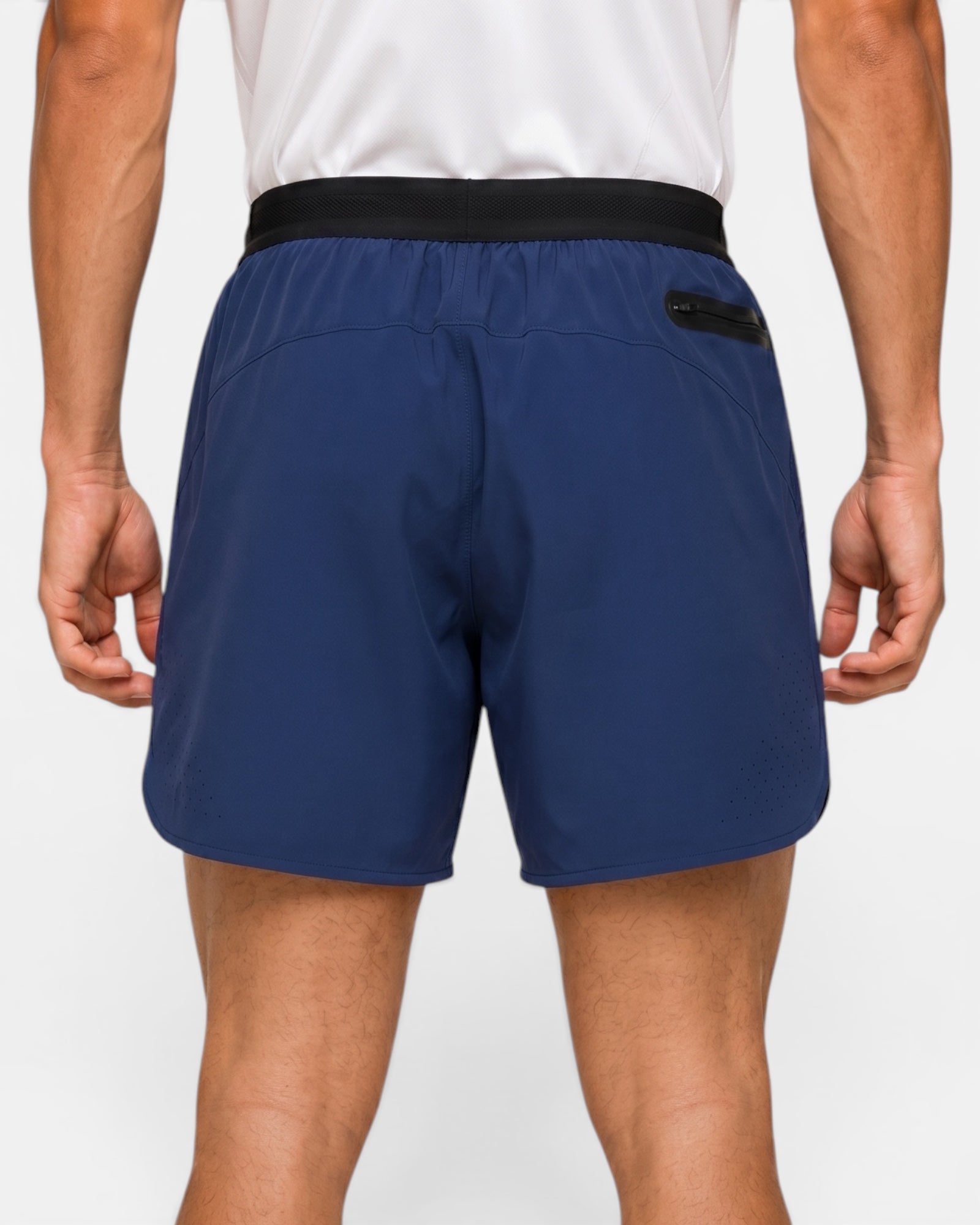 Image of Person wearing blue shorts with a white background