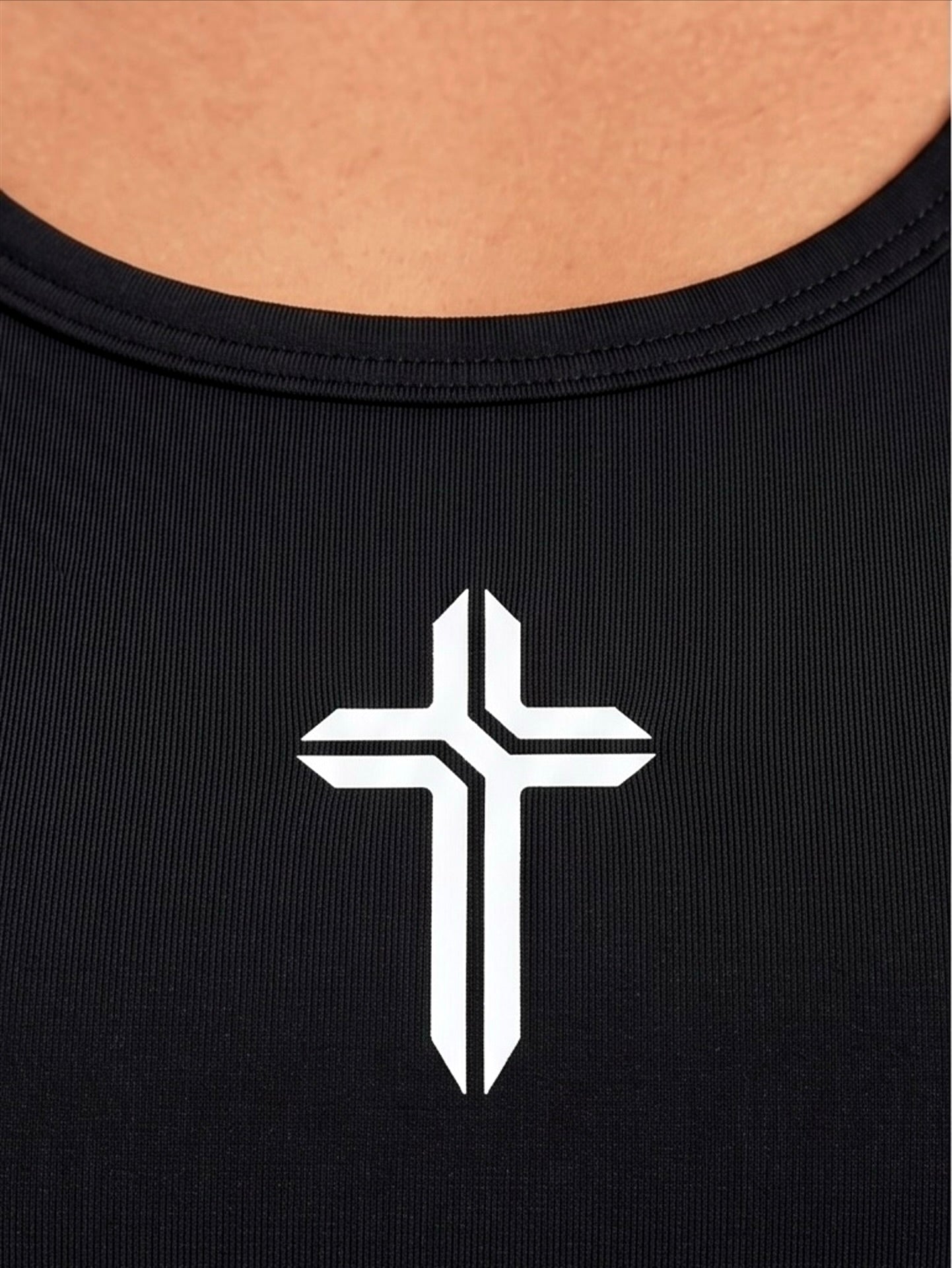 Image of Black tank top with a white cross design on a person's back