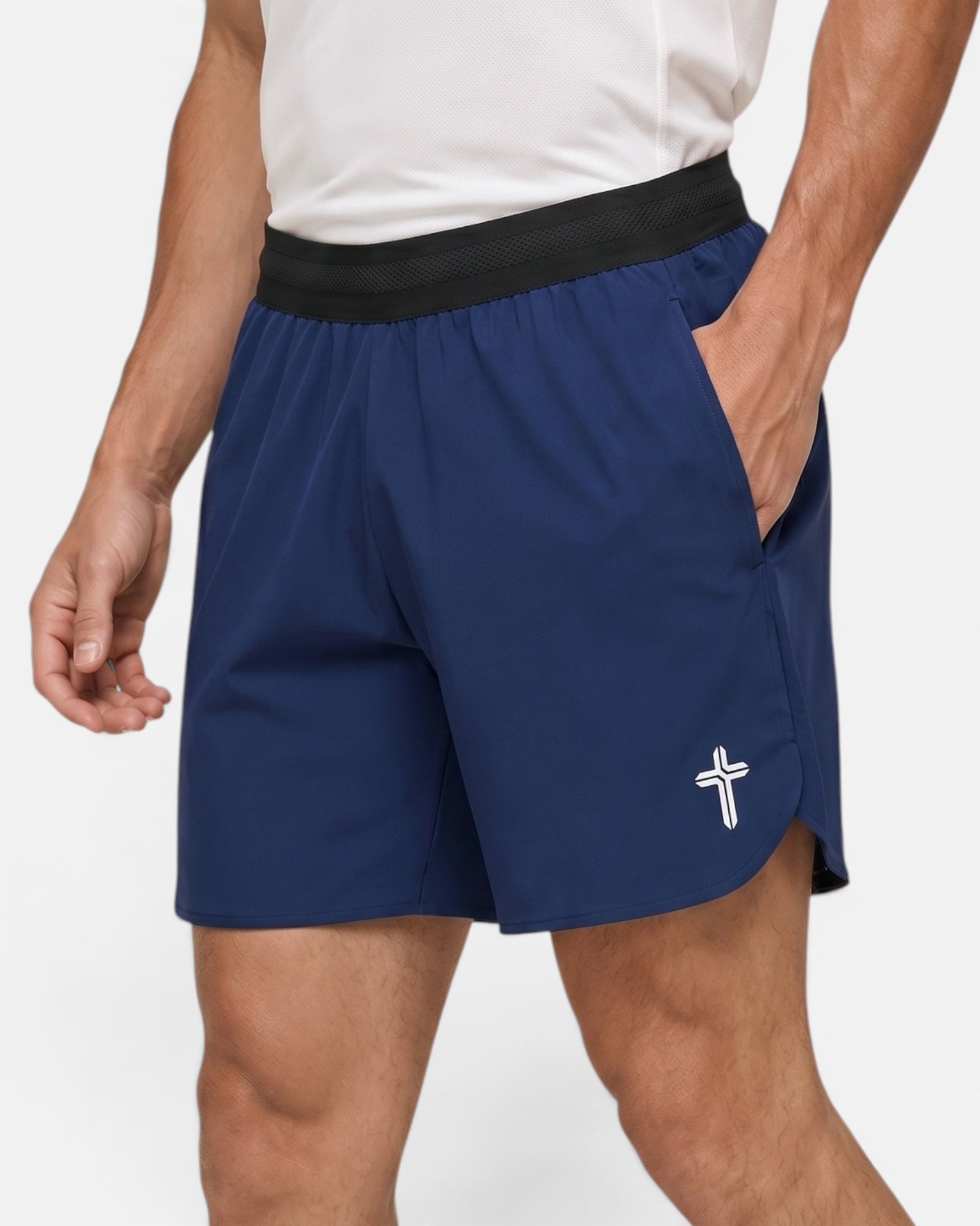 Image of Person wearing navy shorts with a white logo on a light gray background